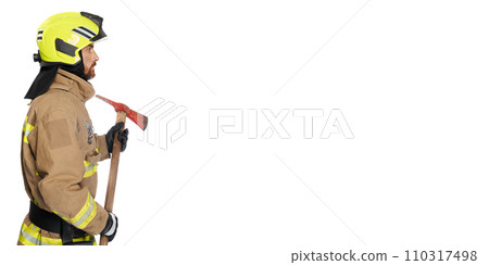 Serious bearded firefighter holding axe tool. Side view of focused male fireman with wooden hatchet looking on copy place beside, isolated on white background. Job, equipment, tool concept. 110317498