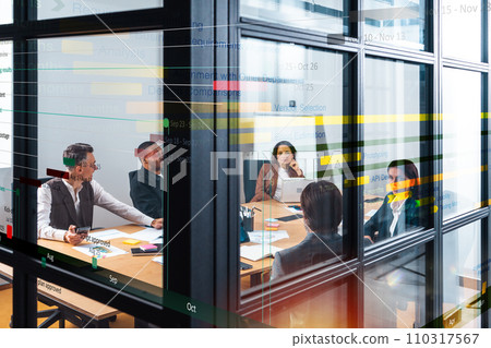 Team of people work together on company statistics in office as teamwork and partnership concept Team of people work together on company statistics in office as teamwork and partnership concept 110317567