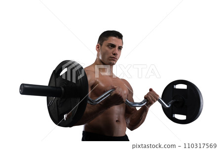Athletic muscular man training biceps at the gym Athletic muscular man training biceps at the gym 110317569