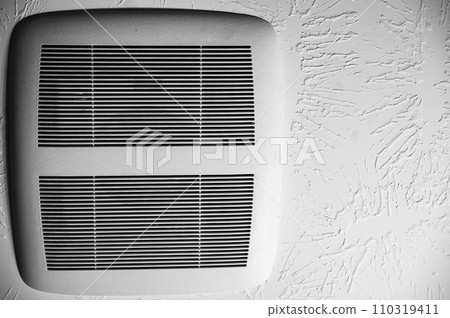 Bathroom vent fan with cover on the ceiling. 110319411