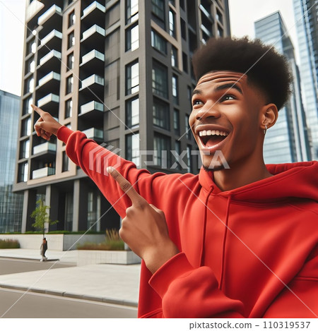 The young man joyfully points to his house The young man joyfully points to his house 110319537