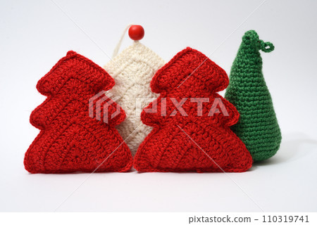 A group of knitted christmas trees 110319741