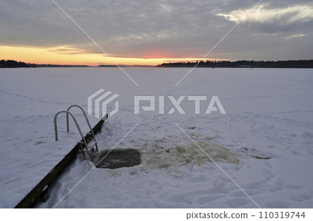 A frozen lake with a ladder A frozen lake with a ladder 110319744