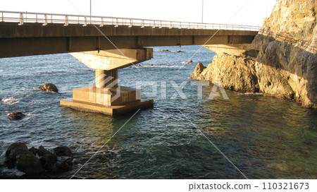 Maritime bridge and cape above the sea 110321673