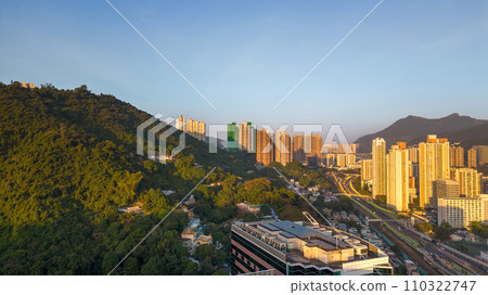 Vibrant city skyline at sunset with skyscrapers and city lights. Dec 24 2023 110322747