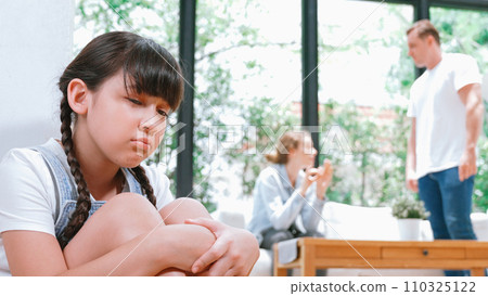 Stressed and unhappy young girl hide from domestic violence at home. Synchronos Stressed and unhappy young girl hide from domestic violence at home. Synchronos 110325122