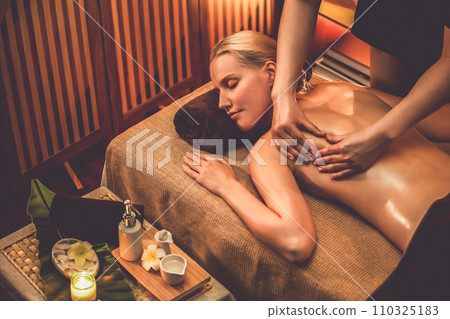 Caucasian woman customer enjoying relaxing anti-stress massage. Quiescent Caucasian woman customer enjoying relaxing anti-stress massage. Quiescent 110325183
