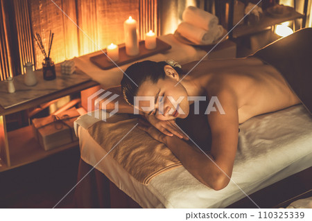Caucasian woman customer enjoying relaxing anti-stress massage. Quiescent 110325339