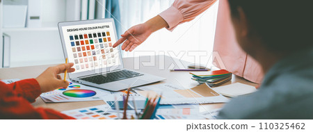 Graphic designer team select appropriate color for project. Closeup. Variegated. Graphic designer team select appropriate color for project. Closeup. Variegated. 110325462