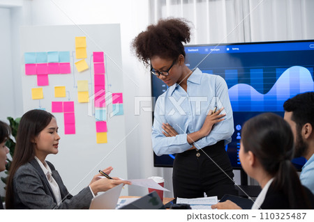 Young african businesswoman presenting data analysis dashboard on TV. Concord 110325487