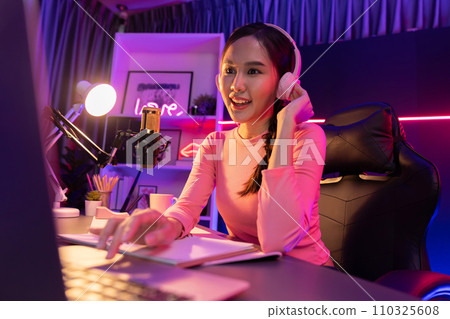 Smiling creative young beautiful Asian influencer talking in channel. Stratagem. 110325608