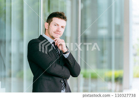 A white male businessman thinking (trading company, trade, global, interpreter, translator) 110327738