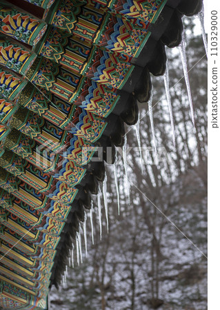 Details of the roofs of traditional Korean houses,Icicles hanging from roof of wooden temple, South Korea 110329000