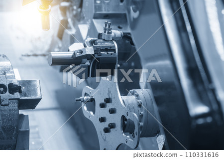The automatic  robotic arm gripping the metal parts from CNC lathe machine. 110331616