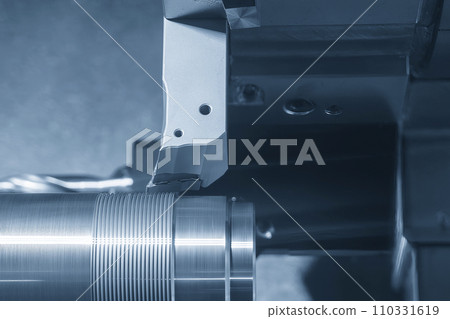 The CNC lathe machine forming cutting the metal shaft parts. The CNC lathe machine forming cutting the metal shaft parts. 110331619