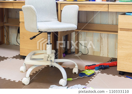 Toys lying under the study desk 110333110