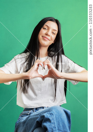 Portrait of a young girl who rejoices in success. Portrait of a young girl who rejoices in success. 110333283
