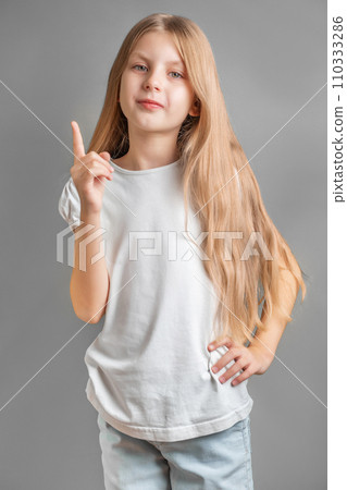 Adorable little girl direct finger up 110333286