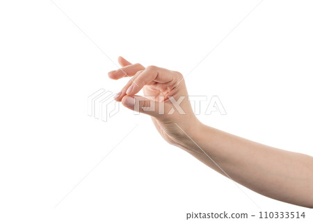 Young woman hand holding something with fingers isolated on white background 110333514