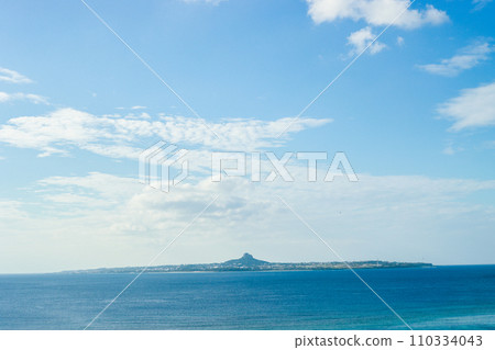 A mountain towering over a lonely island 110334043