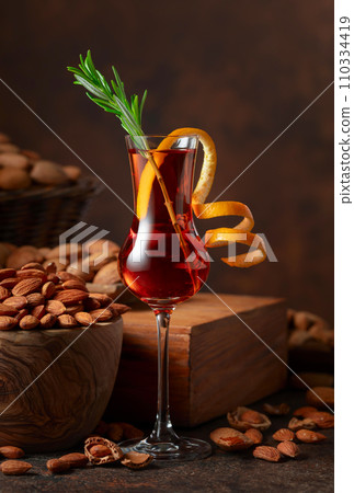 Italian liqueur Amaretto with almonds nuts. Italian liqueur Amaretto with almonds nuts. 110334419