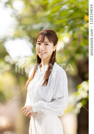 Female yellow leaves portrait 110334654