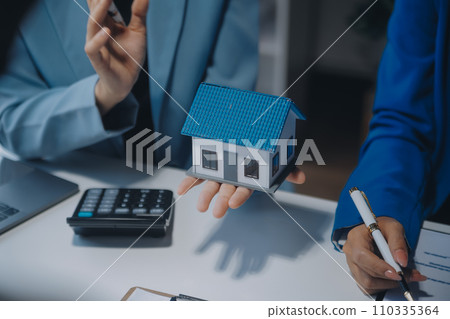 Real estate agent and customer signing contract to buy house, insurance or loan real estate.rent a house,get insurance or loan real estate or property. Real estate agent and customer signing contract to buy house, insurance or loan real estate.rent a house,get insurance or loan real estate or property. 110335364