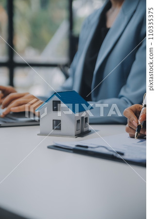 Real estate agent and customer signing contract to buy house, insurance or loan real estate.rent a house,get insurance or loan real estate or property. Real estate agent and customer signing contract to buy house, insurance or loan real estate.rent a house,get insurance or loan real estate or property. 110335375