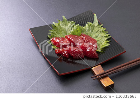 Sujiko on a black plate_black background 110335665