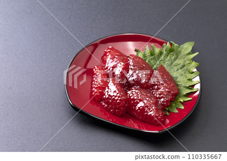 Sujiko on a red half-moon plate_black background 110335667