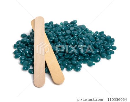 spa wax for depilation in granular form on the white background spa wax for depilation in granular form on the white background 110336064