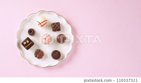 Delicious chocolates on the plate. Delicious chocolates on the plate. 110337321