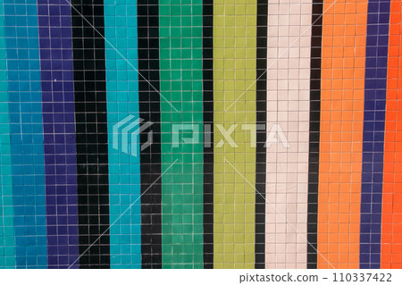 A vibrant and weathered tile mosaic exuding vintage charm, perfect for an eye-catching floor background. 110337422