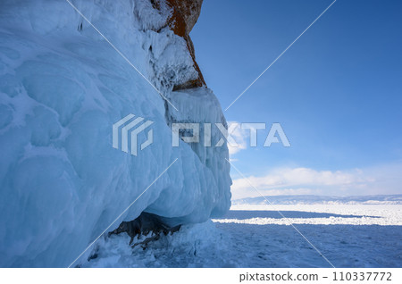 Cape Three Brothers. Beautiful winter landscape of frozen Baikal Lake. Cape Three Brothers. Beautiful winter landscape of frozen Baikal Lake. 110337772