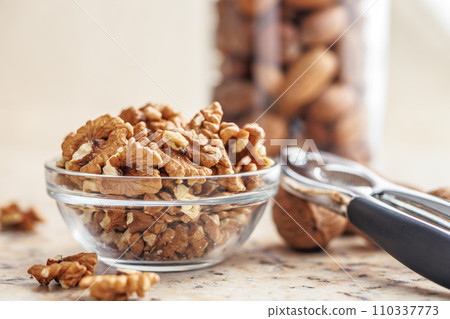 Peeled dried walnut kernels in bowl. Peeled dried walnut kernels in bowl. 110337773