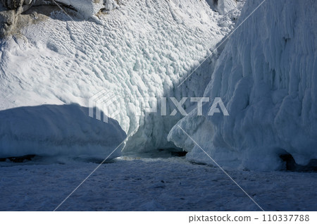 Cape Three Brothers. Beautiful winter landscape of frozen Baikal Lake. Cape Three Brothers. Beautiful winter landscape of frozen Baikal Lake. 110337788