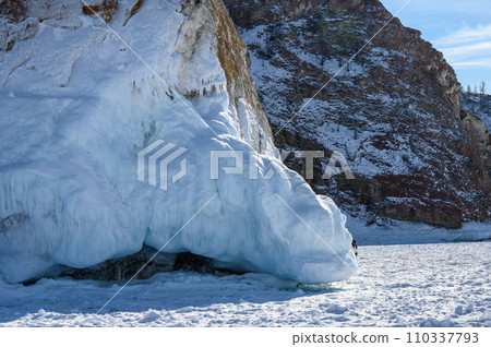 Cape Three Brothers. Beautiful winter landscape of frozen Baikal Lake. 110337793