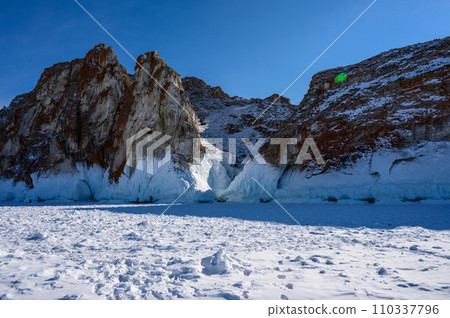 Cape Three Brothers. Beautiful winter landscape of frozen Baikal Lake. 110337796