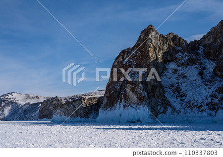 Cape Three Brothers. Beautiful winter landscape of frozen Baikal Lake. 110337803