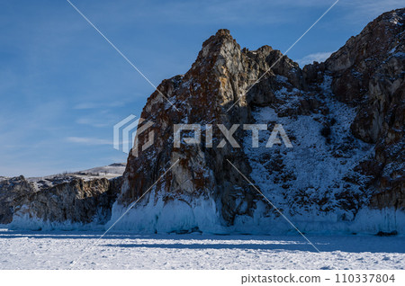 Cape Three Brothers. Beautiful winter landscape of frozen Baikal Lake. 110337804