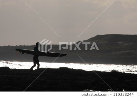 Surfer surfing in the sea of Okinawa 110338244