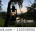 oil lantern and sunset 110338502