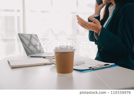 Thinking about how to take the business to technological heights. Cropped shot of an attractive young businesswoman working in her office. 110338976