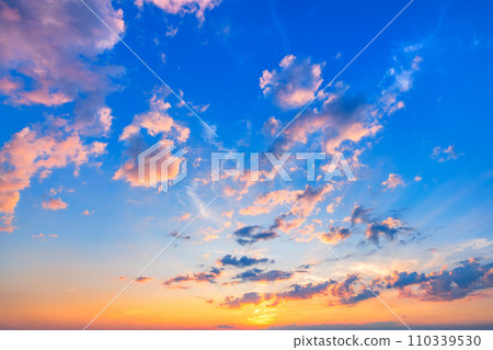 Beautiful sunset sky with fluffly clouds 110339530