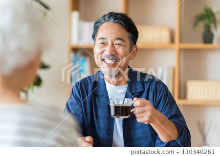A senior couple chatting. A senior couple chatting. 110340261