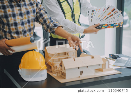Construction and structure concept of Engineer or architect meeting for project working with partner and engineering tools on model building and blueprint in working site, contract for both companies. 110340745
