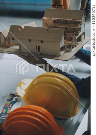Construction and structure concept of Engineer or architect meeting for project working with partner and engineering tools on model building and blueprint in working site, contract for both companies. Construction and structure concept of Engineer or architect meeting for project working with partner and engineering tools on model building and blueprint in working site, contract for both companies. 110340755