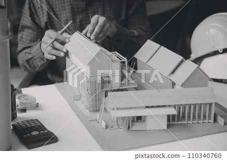 Construction and structure concept of Engineer or architect meeting for project working with partner and engineering tools on model building and blueprint in working site, contract for both companies. 110340760
