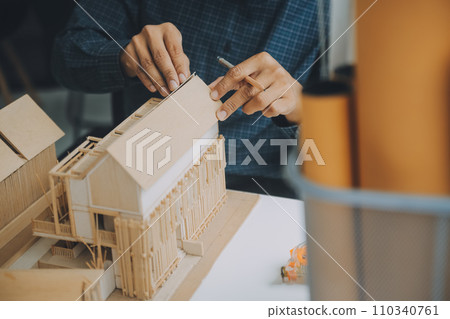 Construction and structure concept of Engineer or architect meeting for project working with partner and engineering tools on model building and blueprint in working site, contract for both companies. 110340761