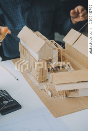 Construction and structure concept of Engineer or architect meeting for project working with partner and engineering tools on model building and blueprint in working site, contract for both companies. 110340762